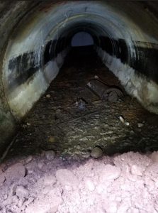 Main sewer line filled with debris - 54” diameter
